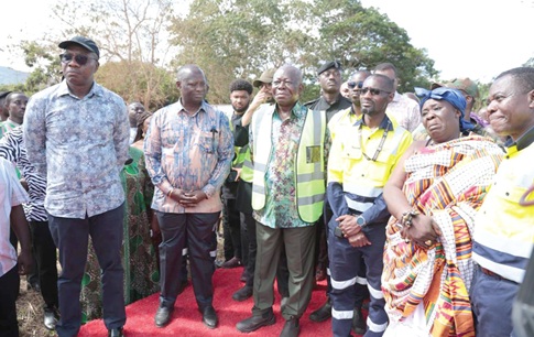 Otumfuo Osei Tutu II (3rd left), the Asantehene, Emmanuel Armah-Kofi Buah (2nd from left), the Minister of Lands and Natural Resources, Mahama Ayariga (left), the Minister of Local Government, Culture and Religious Affairs, and Samuel Pobee (3rd from right), MD of AngloGold Ashanti, inspecting the polluted Jimi Dam (inset)