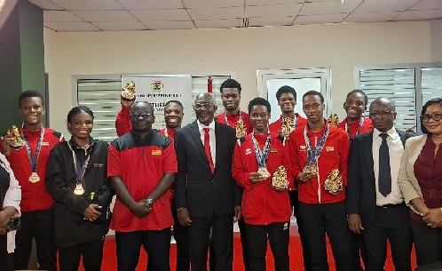 Black Shuttlers in group photo with Dr Wuaku, Administrstor of the Ghana Sports Fund