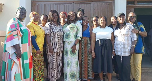 Rita Odoley Sowah (4th from left), Member of Parliament of La Dadekotopon, with the 13 female aspirants
