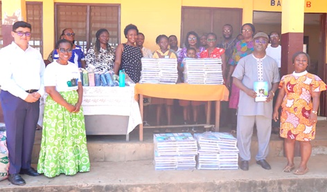 Sahil Vyas (left), Assistant General Manager (Polytank ROTO), Moudline Duodua Gyan (2nd from left), Media Relations Manager Polytank, Benjamin Amusah (right), Polytank distributor and a teacher from TWMA Primary School, and other teachers after the presentation
