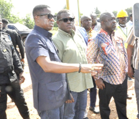 Sam Nartey George, Minister for Communication, Digital Technology and Innovations, flanked by Tanko Rashid Computer (left), the Chief Executive Officer of the Ghana Investment Fund Electronic Communications, and James Gunu, Volta Regional Minister, at a rural telephony project site at Akoefe-Gadza