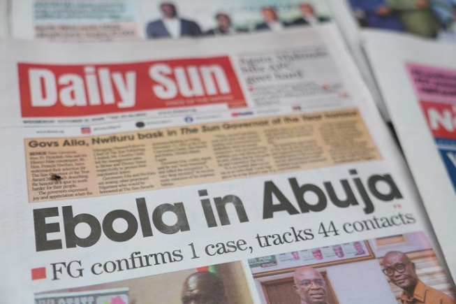 A newspaper's front page carrying a headline about a reported Ebola case in Nigeria's capital, Abuja, is displayed at a newspaper stall in Lagos, Nigeria, October 21, 2026. REUTERS/Sodiq Adelakun
