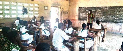 Andrews Dawuni, Headmaster of Kandin R/C Junior High School, teaching in the classroom