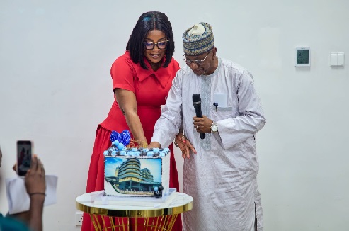 Dr Genevieve Ama Brown, a Family Physician Specialist at SMSH joined by a  board member to cut the anniversary cake
