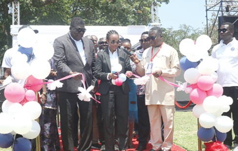 Dr Zanetor Agyeman-Rawlings (middle), Minister of Environment, Science and Technology, cutting the ribbon to officially open the CSIR fair. With her are Prof. Paul Pinnock Bonsu (right), Director-General, CSIR, and Mark Anthony Taylor (left), Council Chairman, CSIR. Picture: BENEDICT OBUOBI
