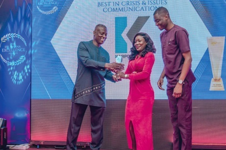 Sandra Amarquaye (middle) accompanied by Michael Sa-ambo (right), Communications Specialist at Karpoweship Ghana Limited, receiving her award