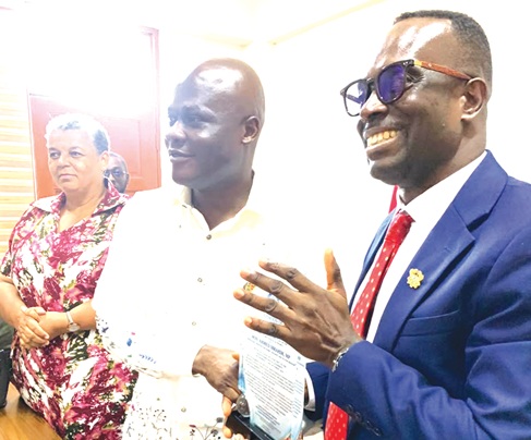 Sylvester Darko (right), Chief Executive Officer, HYDRO, presenting a plaque to  Ahmed Ibrahim (2nd from right), Minister of Works, Housing and Water Resources,  during his familiarisation visit to the HYDRO