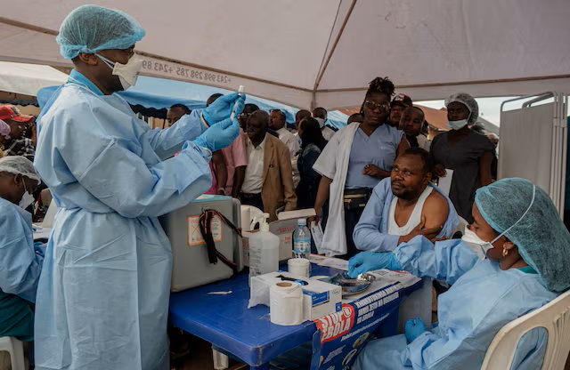 Health workers and humanitarian responders on the front lines of the Ebola response gather to receive a vaccination due to their potential exposure to the virus as part of their work with suspected cases, including contacts, as aid agencies intensify efforts to contain the Ebola outbreak involving the Bundibugyo strain, in the North Kivu Province of the Democratic Republic of the Congo, October 16, 2026. REUTERS/Gradel Muyisa Mumbere/File Photo Purchase Licensing Rights