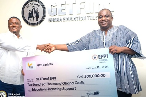 Alhaji Alhassan Sualihu Dandaawa (right), Deputy Administrator of GETFund, receiving the cheque from Abraham Ferguson Yahaya, Chief of Staff of the GCB Bank