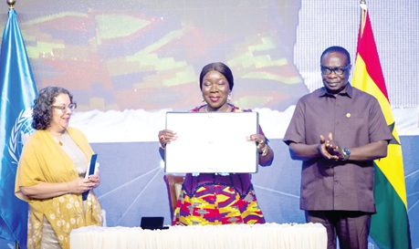 Elizabeth Ofosu-Adjare (middle), Ministry of Trade, Agribusiness and Industry, displaying the signed Accra Convention. Looking on is James Gyakye Quayson (right), Deputy Minister of Foreign Affairs 