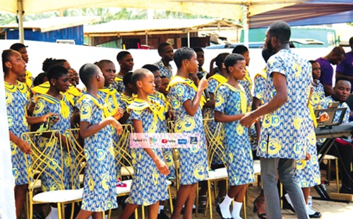 Schoolchildren singing during the 10th anniversary celebration