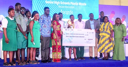 Students and teachers of Odorgonno Senior High School receiving the dummy cheque. INSET: Students of Odorgonno SHS cheering and jubilating after winning the award. Picture: ERNEST KODZI
