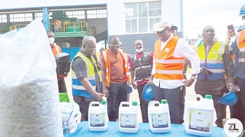 Michael Padi Tuwor (left), Managing Director of ACARP, introducing some of the recycled products from the recycling plant to Mahama Ayariga (right), Minister of Local Government, Chieftaincy and Religious Affairs. Looking on is Dr Joseph Siaw Agyepong (middle), Executive Chairman of Jospong Group