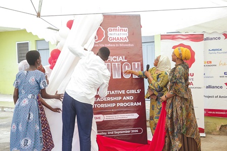 Amina Awudu (2nd from right), Deputy Director of Supervision in the Education Directorate of Ayawaso East Municipal Assembly, assisted by Amdiya Abdul-Latiff (right), Founder and CEO of Eco-Me Africa, and Ayuba Mamadu Mohammed (2nd from left), Director of Aminu Initiative Ghana, to unveil the mentorship programme. Picture: CALEB VANDERPUYE