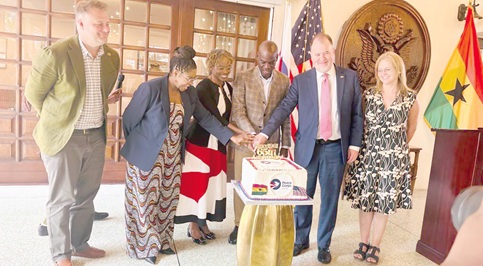 Haruna Iddrisu (3rd from right), Minister of Education, cutting the 65th anniversary cake with Glenda Green­­­ (3rd from left), Chief of Operations of Peace Corps Washington, Rolf Olson (2nd from right), Chargé d’Affaires of the United States Embassy in Ghana, Tamu Daniel (2nd from left), Country Director of Peace Corps Ghana, at the event