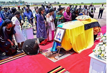Family members and mourners attend the ceremony to receive the coffin with the body of King Oyo Nyimba Kabamba Iguru Rukidi IV, of the Tooro Kingdom, who died in late August aged 34 while receiving treatment in the US, at the Entebbe International Airport, in Entebbe, Uganda