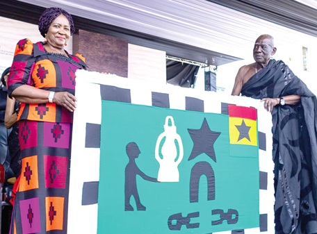 Vice-President Prof. Naana Jane Opoku-Agyemang (left) receiving a painting depicting the history of the Trans Atlantic Slave Trade from Osabarimba Kwesi Atta ll, Omanhen of Oguaa Traditional Area 
