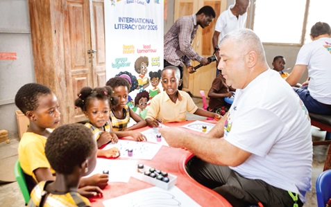 Some staff of Karpowership engaging learners  in a painting activity