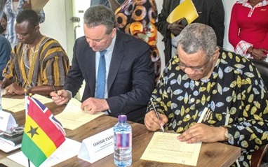 Augustus Goosie Tanoh (right), Presidential Advisor, 24-Hour Economy and Accelerated Export Development, and Rod Bassett (2nd from right), CEO, Agrium Capital Limited, signing the documents with other partners. Picture: ERNEST KODZI