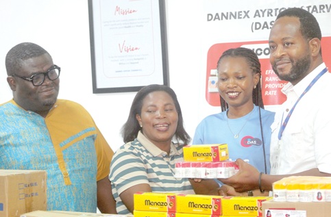 Bernard Alidu (right), Corporate Affairs Manager at Dannex Ayrton Starwin PLC, with Christiana Mensah (2nd from right), Customer Relations Management Lead, presenting the drugs to Kyerewaa Asiamah Wiafe (2nd from left), acting Corporate Communications Manager at GCGL. Also present is Francis George Ekumah (left), Chief Sales and Marketing Officer, Dannex. Picture: ESTHER ADJORKOR ADJEI