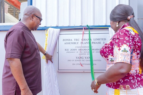 President John Dramani Mahama (left), being assisted by Elizabeth Ofosu-Adjare (right), Minister of Trade, Agribusiness and Industry, to commission the Zonda Tec phase III project