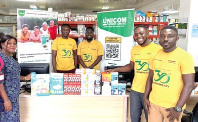Dr Darrell Neneyo Amoatey (2nd from right), Marketing Coordinator of Unicom Chemist Limited, handing over the donated medicines to Ruth Addo (2nd from left), Assistant Corporate Officer of GCGL. With them are other staff of Unicom Chemist Limited