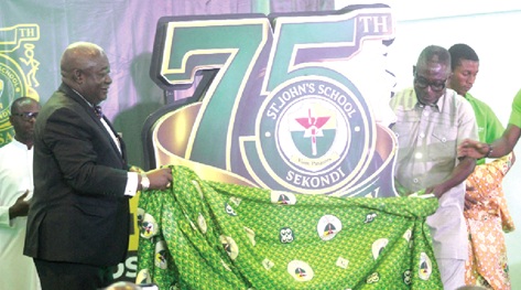 Dr Henry Benyah (left), Chairman of the occasion, and Dr Kwesi Enyan (right), Director of Operations at Rocksure International Ltd, unveiling the anniversary logo. Picture: ESTHER ADJORKOR ADJEI