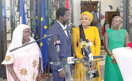 Ibrahim Mahama (2nd from left) delivering a speech at the ceremony as Diarra Dimé-Labille (right), the French Ambassador to Ghana, and his mother (left) and wife look on