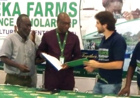 Prof. Eric Nyarko Sampson (middle), Vice-Chancellor of UESD, and Mark Aboujaoude, the representative of Maleka Farm Limited, exchanging the signed document 