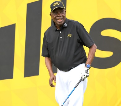 MTN Ghana Board Chairman Dr Ismael Yamson surveys the fairway before teeing off.