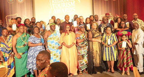 Maame Efua Houadjeto (5th from left), CEO of the Ghana Tourism Authority, with Roberta Baaba Mprah Arhinful (4th from right), Greater Accra Regional Director of Ghana Tourism Authority; Azumah Nelson (right), Ghanaian former professional boxer, distinguished officials, and award winners after the event. Picture: CALEB VANDERPUYE
