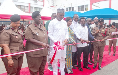 Mubarak Mohammed-Muntaka (3rd from left), Minister for the Interior, commissioning the vehicles (inset). Looking on are Daniela Mawusi Ntow Sarpong (2nd from left), Chief Fire Officer, other dignitaries and some fire officers. Picture: ERNEST KODZI