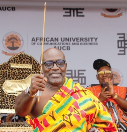 Frank Brako Adu Jnr, Chancellor, African University of Communications and Business, raising the instrument of office after being sworn into office