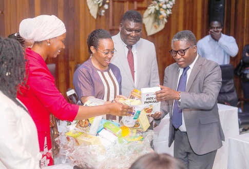 Prof. Paul Bosu (right), Director-General, Council for Scientific and Industrial Research, presenting some products made by the institute to Dr Zanetor Agyeman-Rawlings (middle), Minister of Environment, Science and Technology. Picture: ELVIS NII NOI DOWUONA