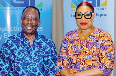 Alex Apau Dadey (left), Chairman, KGL Group, with Helga Boadi, Executive Director, GNPC Foundation