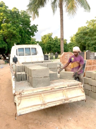 • A labourer getting ready to prepare a grave at the Madina Public Cemetery in Accra