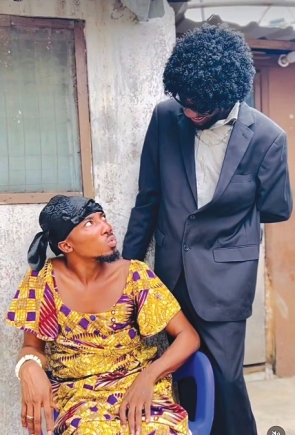 Deaconess Abokomah (seated) cross-dresses to portray female characters