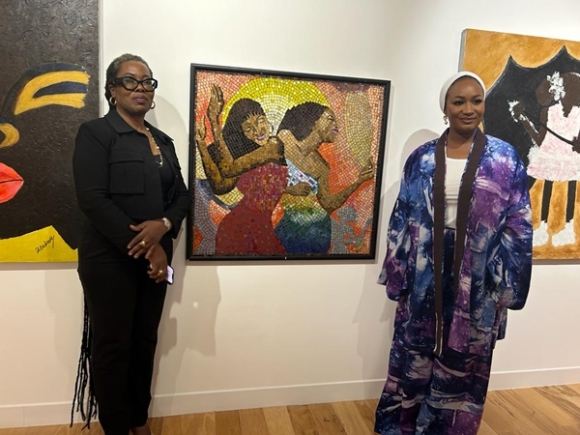 Mrs Samira Bawumia (right) and Osafohene Dr Afua Asabea Asare pose by one of  the works of Osafohene.