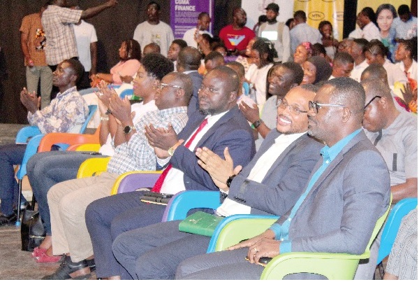 Kwabena Asamoah Boahene (3rd left), Editor of Graphic Business, and some dignitaries applauding the contestants.
