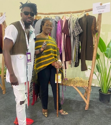 Mr Kweku Bediako Oduro, Creative Director/Founder of Chocolate Clothes Global ( left) with Dr Afua Asabea Asare at the CANEX Creative Africa Nexus pavilion at the ongoing fair.