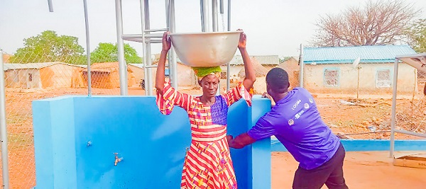 A resident of Yameriga fetching water from the borehole