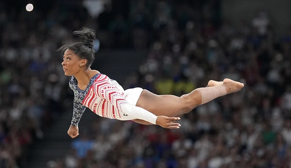 Simone Biles performing gymnastics routine at the Paris 2024 Olympics (Credit: AP) Simone Biles performing gymnastics routine at the Paris 2024 Olympics (Credit: AP)