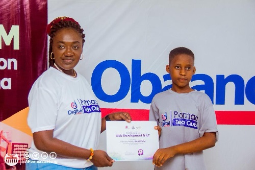 Member of Parliament for Juaben, Ama Pomaa Boateng presenting a certificate to one of the beneficiaries Member of Parliament for Juaben, Ama Pomaa Boateng presenting a certificate to one of the beneficiaries