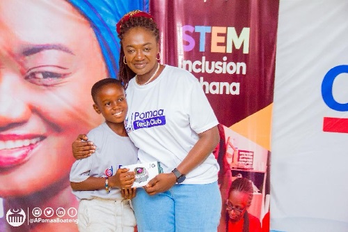 Member of Parliament for Juaben, Ama Pomaa Boateng presenting a prize to one of the beneficiaries Member of Parliament for Juaben, Ama Pomaa Boateng presenting a prize to one of the beneficiaries