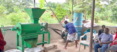 A resident of the community starting the machine