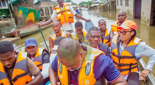 The delegation hitched a boat ride to seriously affected areas of the community