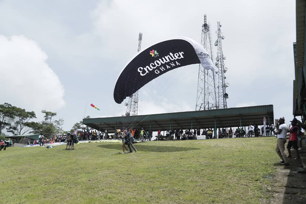 A pilot taking off at the Kwahu paragliding site