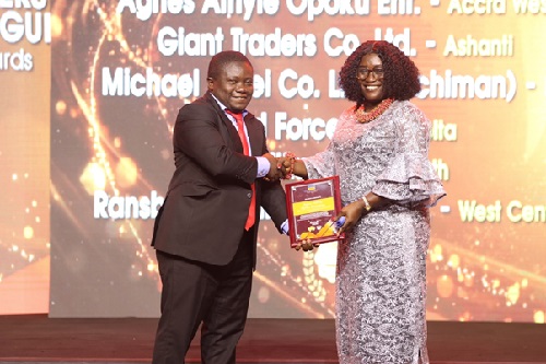 Accra West based Agnes Afriyie Opoku Ent receiving award for Best Cowbell Coffee Distributor
