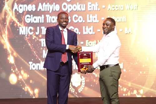 Ashanti based Giant Traders receiving award for Best Cowbell Flavours Distributor.