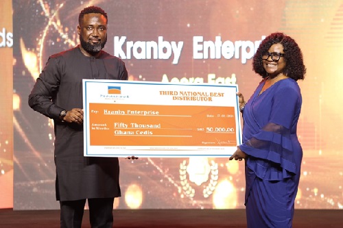 National Best Distributor- 3RD. Position, Kranby Enterprise receives prize from Commercial Director, Mr. Abiodun Ayodeji.